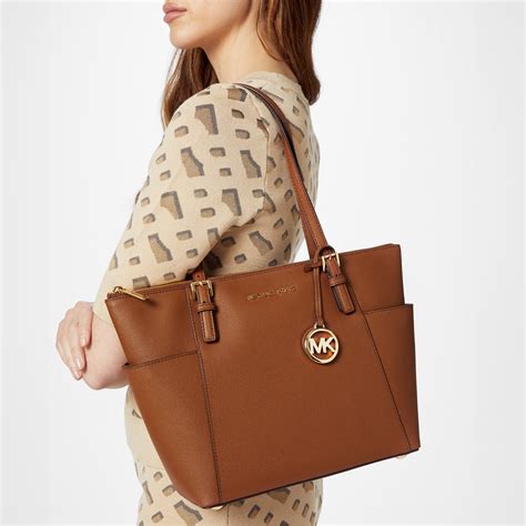 michael kors jet set tote bag orange|michael kors airplane print bag.